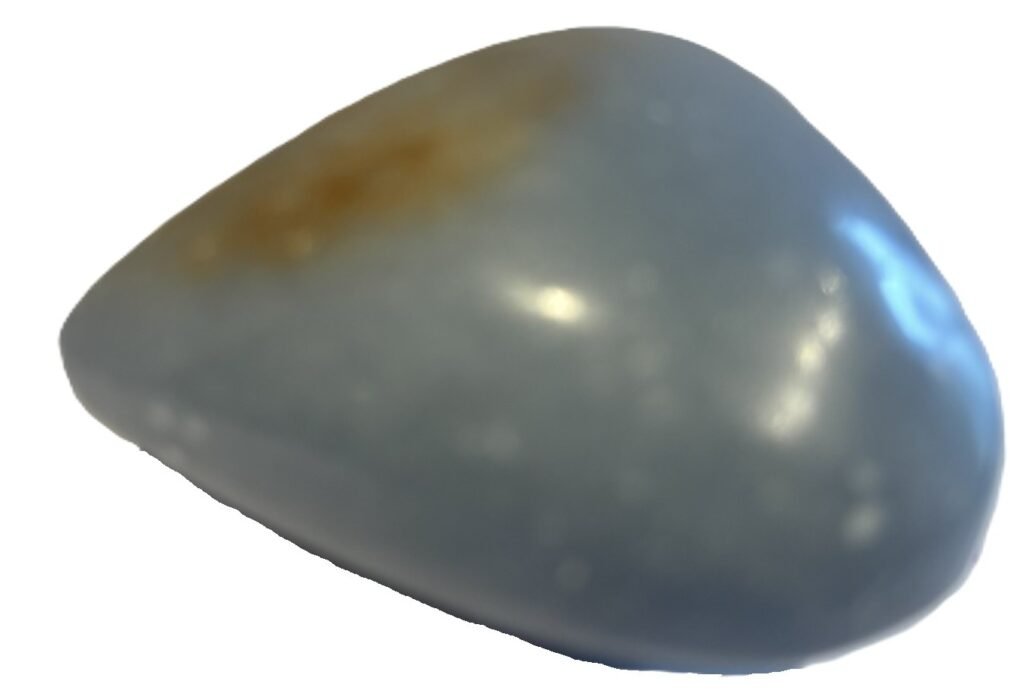 Polished natural angelite carved heart crystal 2 sians emporium Smooth polished blue angelite carved heart crystal showing natural white mineral flecks on a white background